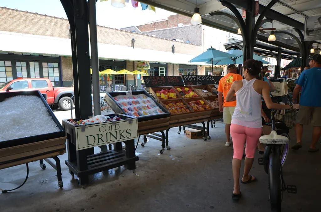 Produce stalls and a cold drinks cooler at the French Market in New Orleans