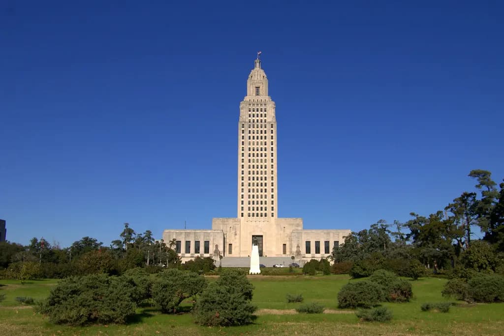 The Louisiana State Capitol tower in Baton Rouge under a clear blue sky