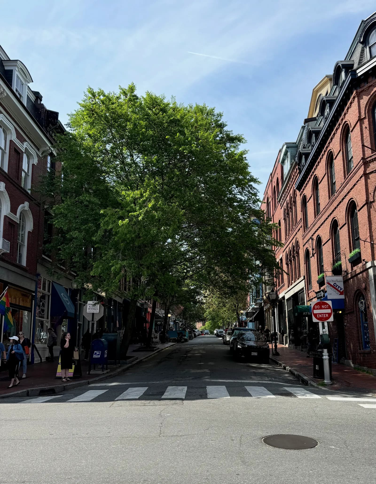 Brick buildings and shopfronts along Exchange Street in Portland's Old Port, seen from Fore Street