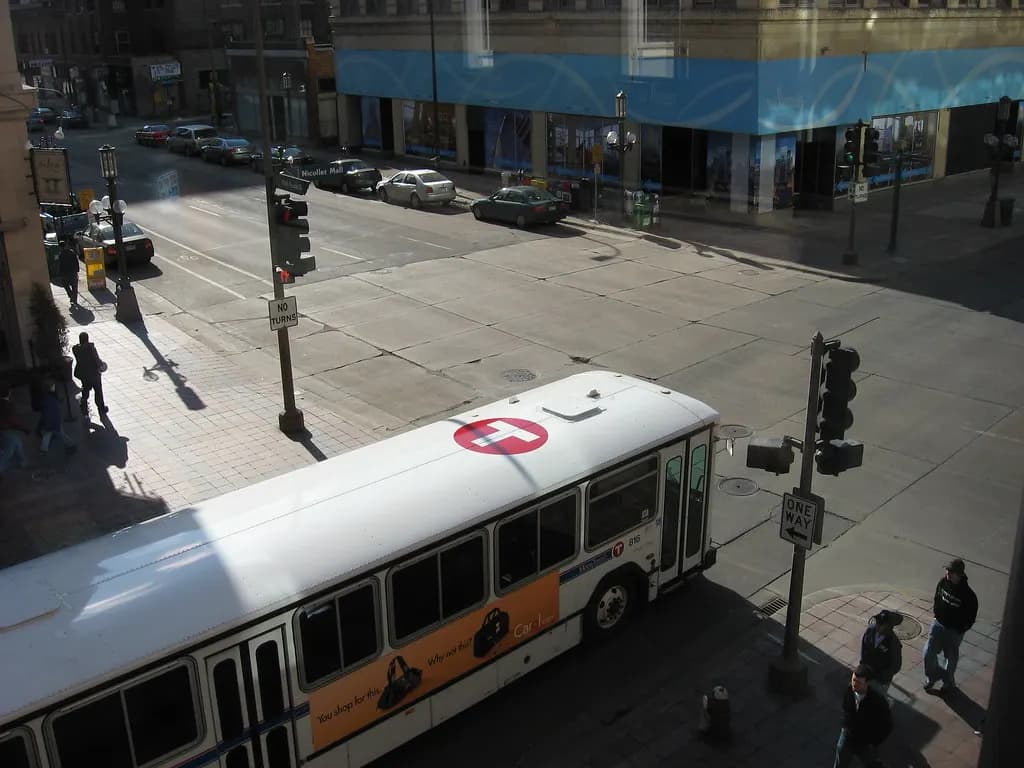 Nicollet Mall at 10th Street South in downtown Minneapolis seen from above, with a city bus and shopfronts