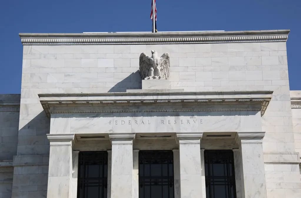 Marble facade of the Federal Reserve's Eccles Building in Washington, DC, with an eagle above the entrance