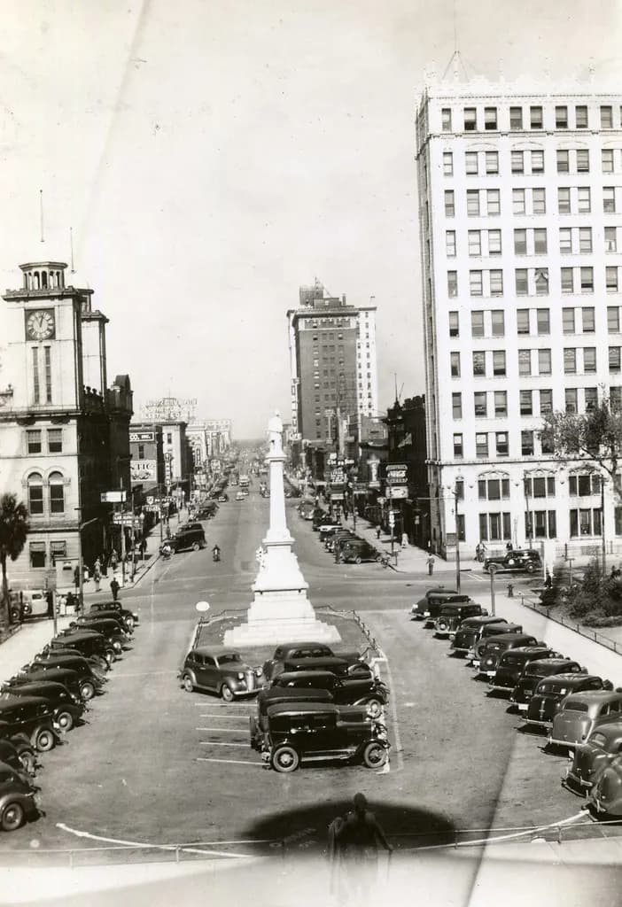 Historic black-and-white photo looking up Main Street in Columbia, South Carolina, from the State House grounds