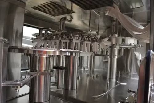 Stainless-steel bottle filling machine on a contract production line