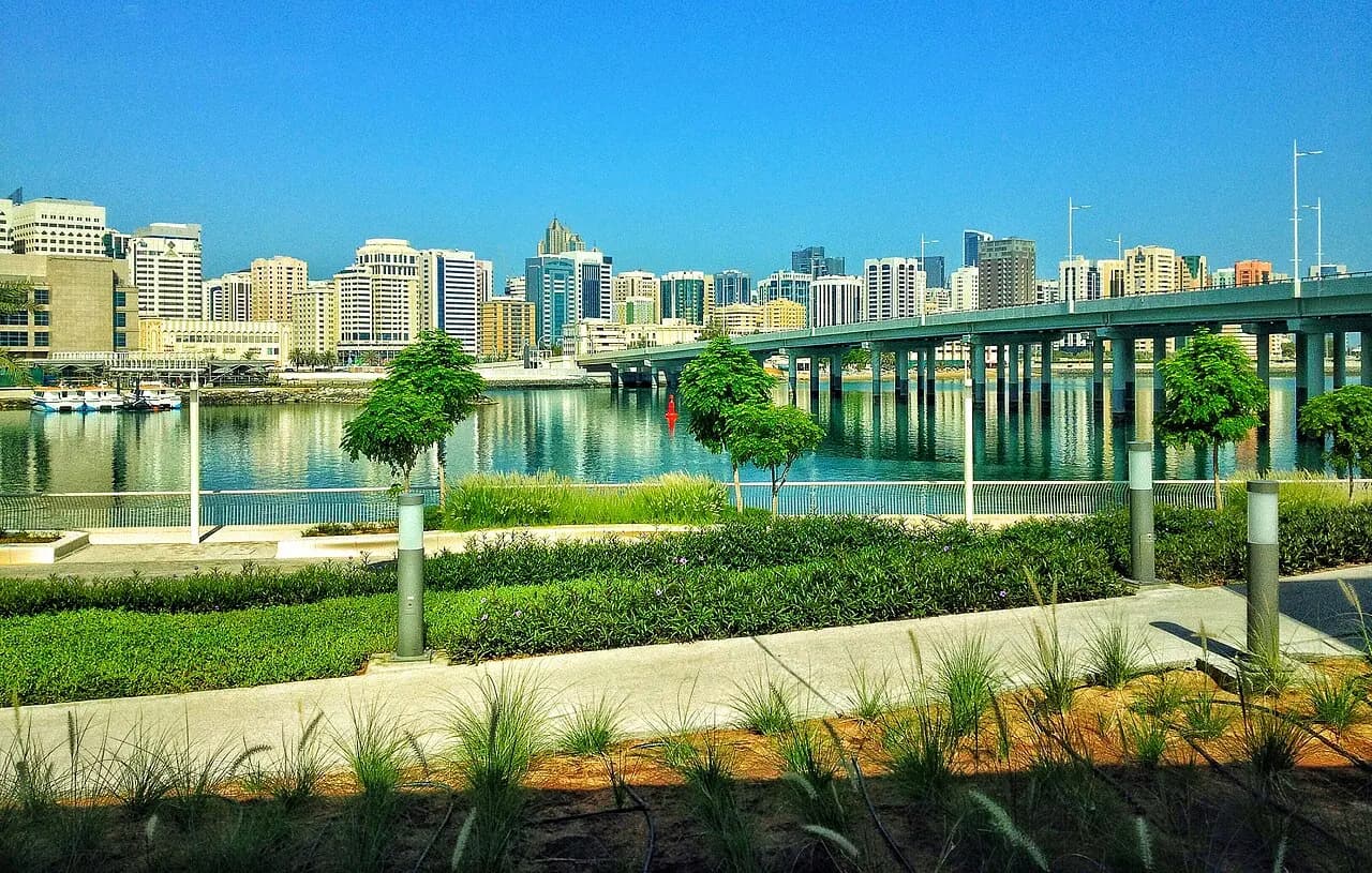 View across the water from Al Maryah Island promenade towards central Abu Dhabi
