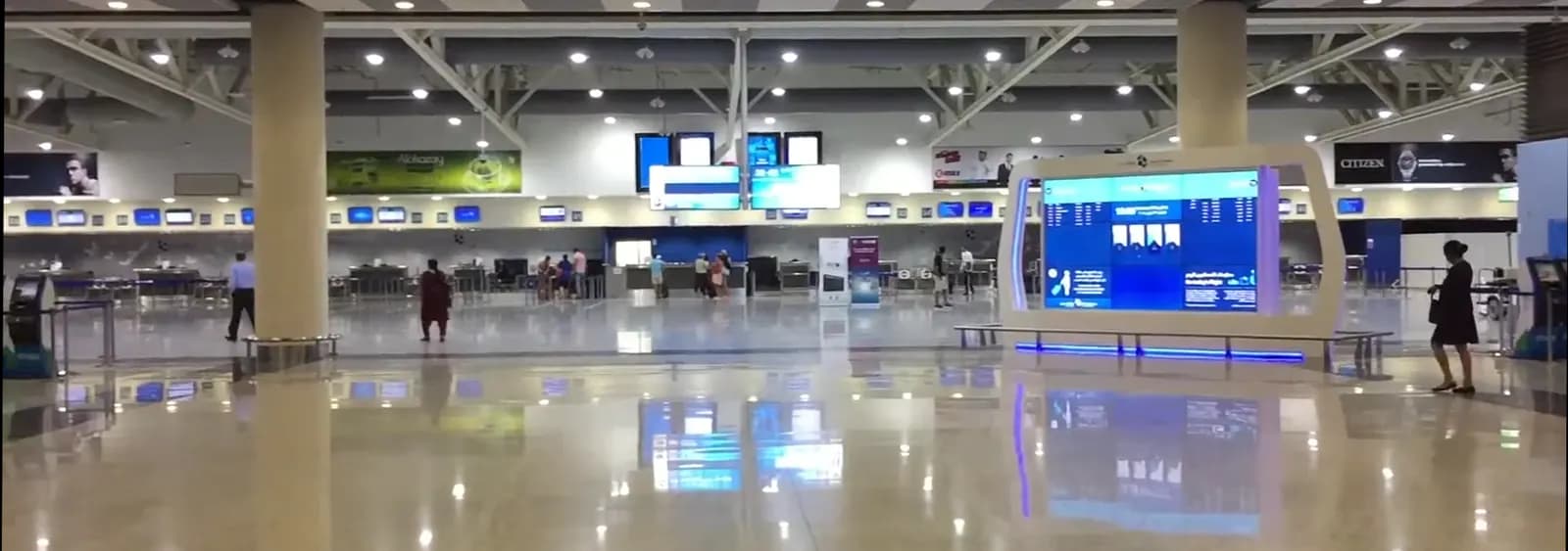 Wide view of Al Maktoum International Airport's runway and apron in 2016