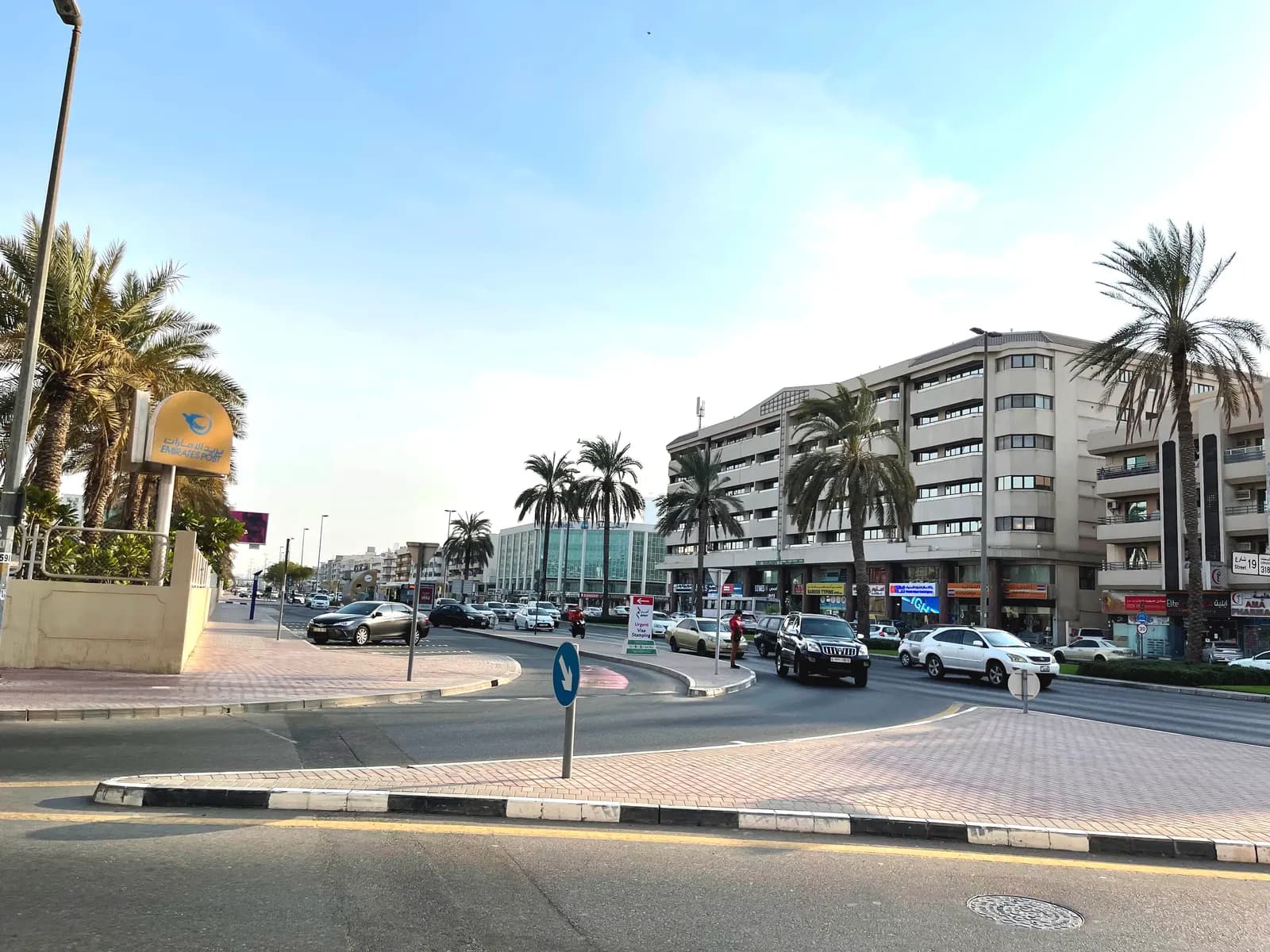 A street in Al Karama, Dubai, with shops on the ground floor of residential buildings