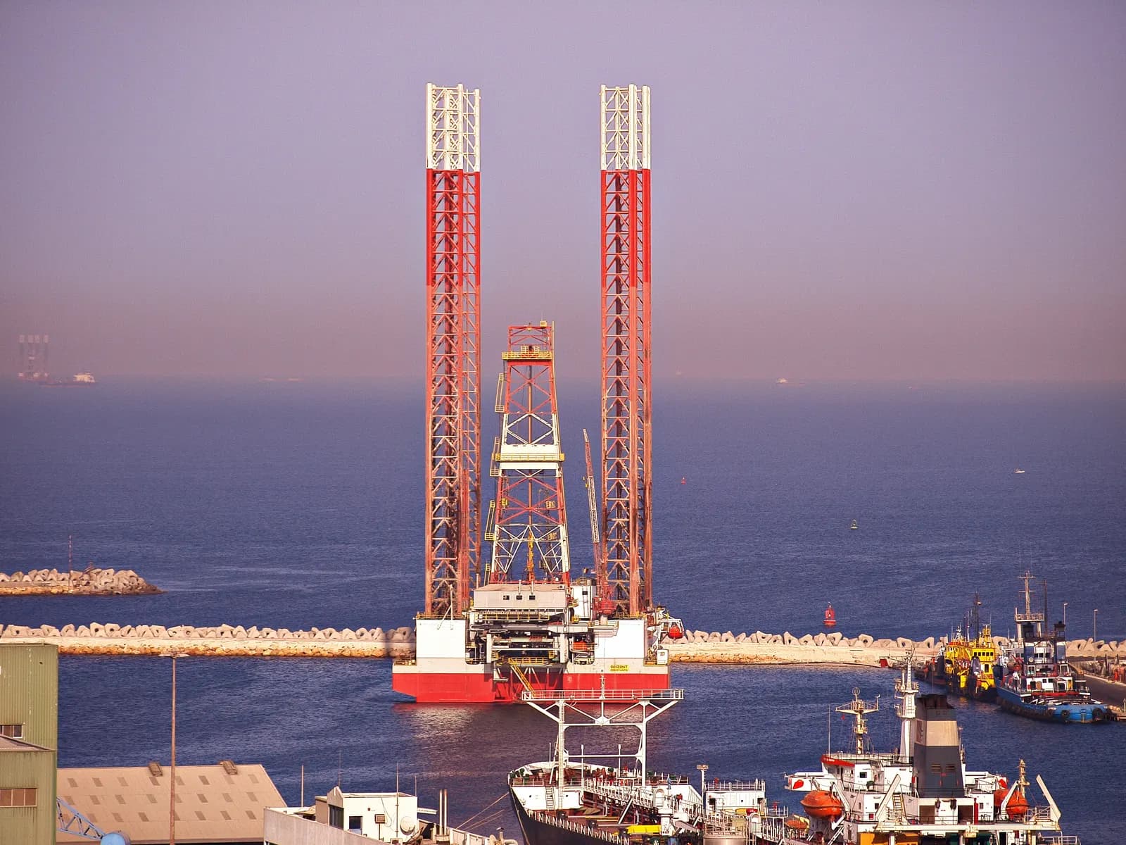 Jack-up oil rig and support vessels moored at Port Khalid on the Sharjah coast