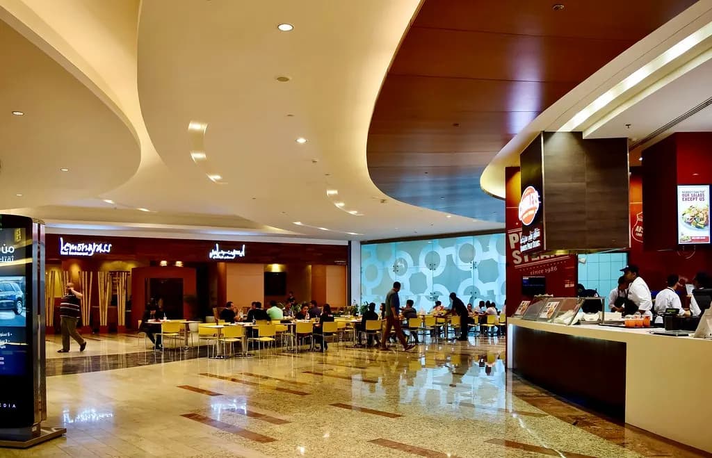 Restaurant counters and seating in the dining district of Al Ghurair Centre, a Deira shopping mall in Dubai