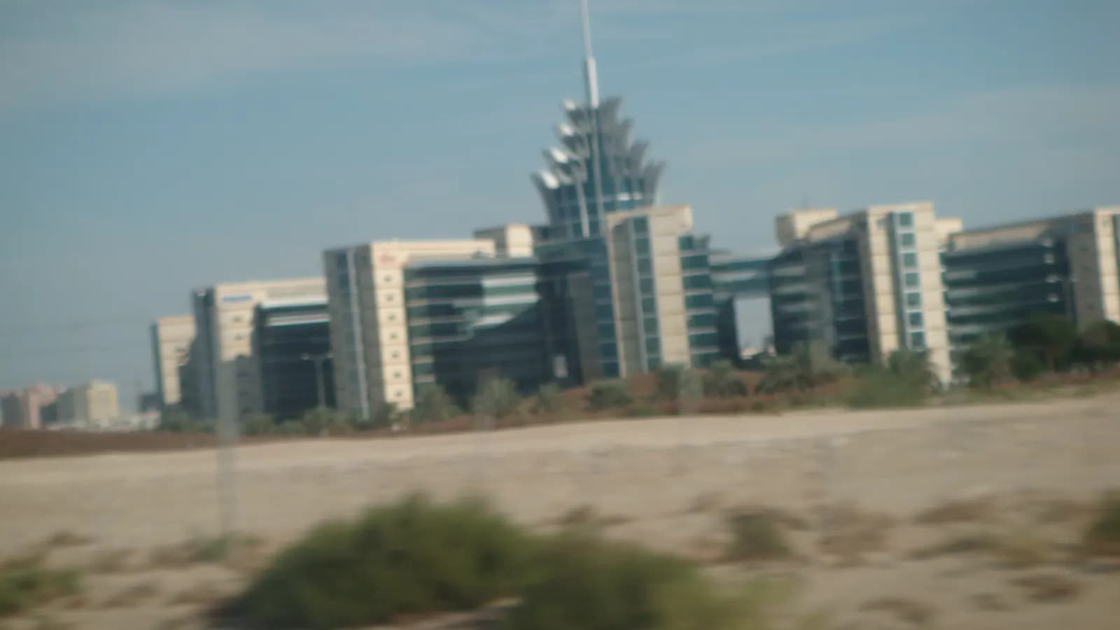 Dubai Silicon Oasis headquarters buildings seen across open ground in Dubai