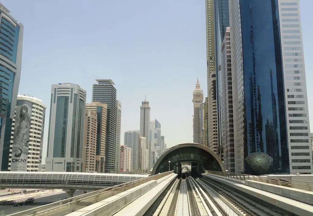 Dubai Metro track running between office towers on Sheikh Zayed Road