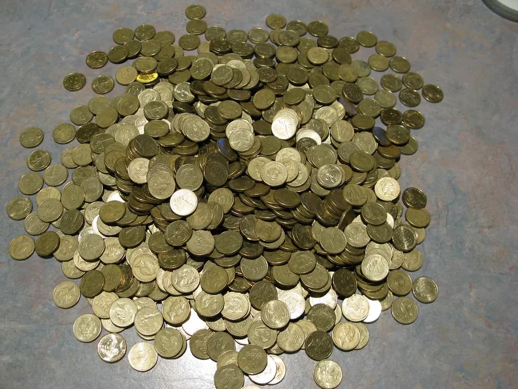 A large pile of Australian one-dollar coins
