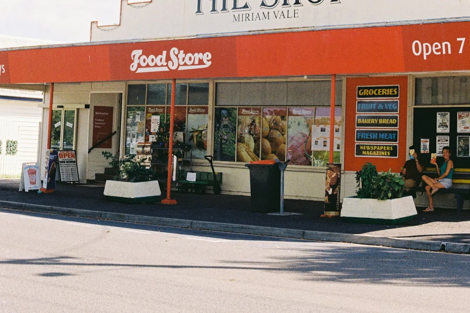 Red-and-white country store called The Shop with its trading name across the awning in Miriam Vale, Queensland