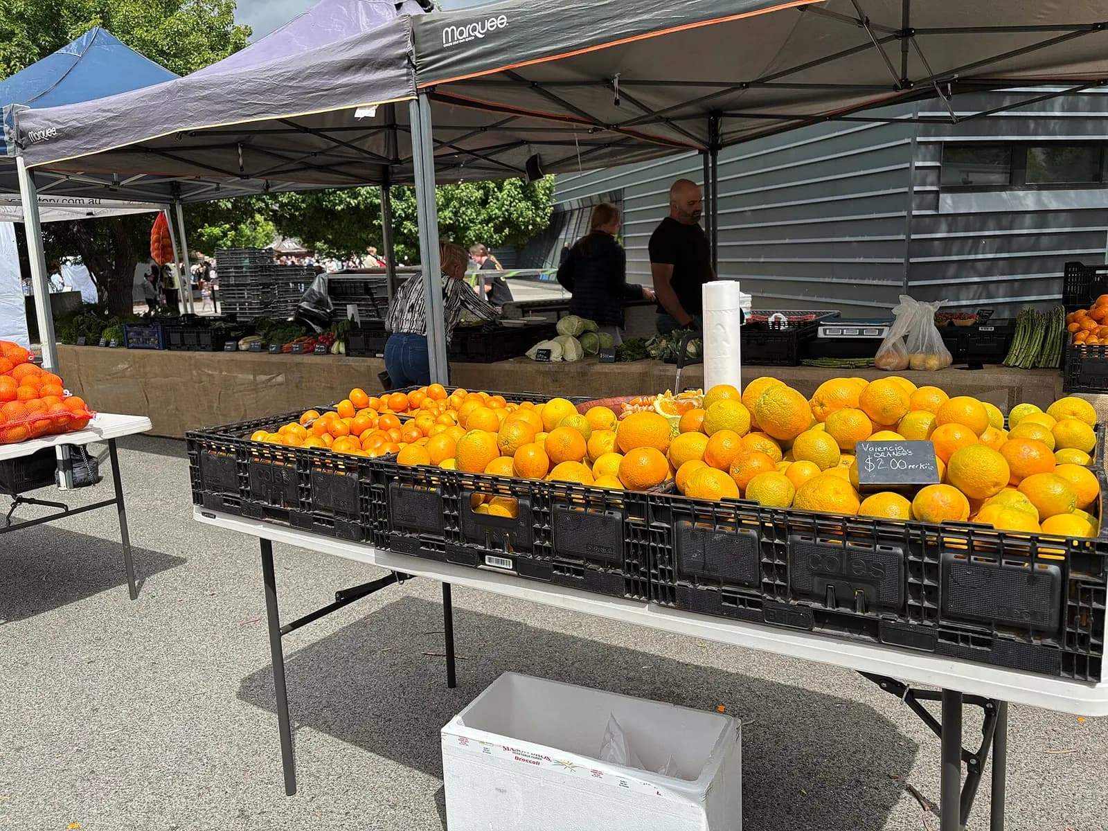 Fruit and vegetable stall with crates of produce at the Southside Farmers Market in Canberra