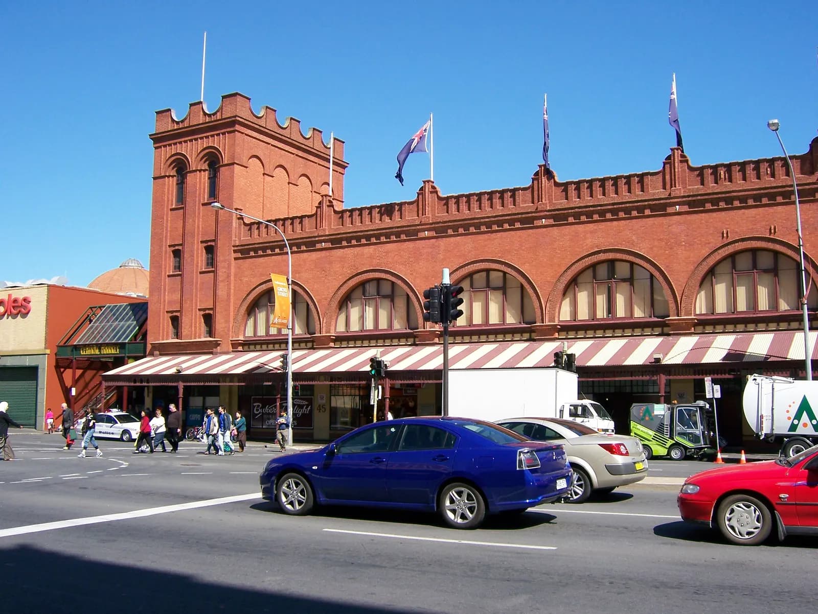The red-brick Grote Street frontage of the Adelaide Central Market under a blue sky