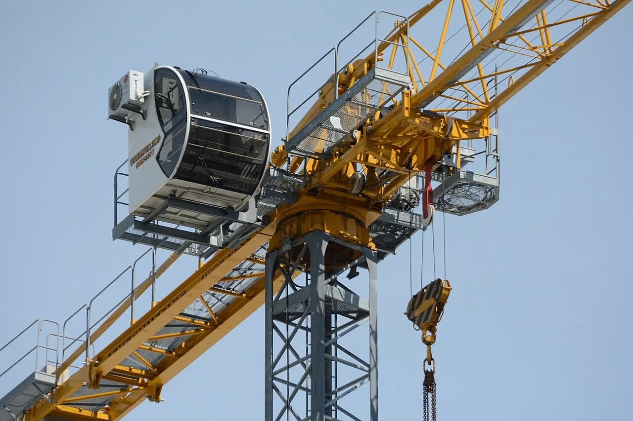 Tower crane cab and hook above a construction site in Bondi Junction, Sydney