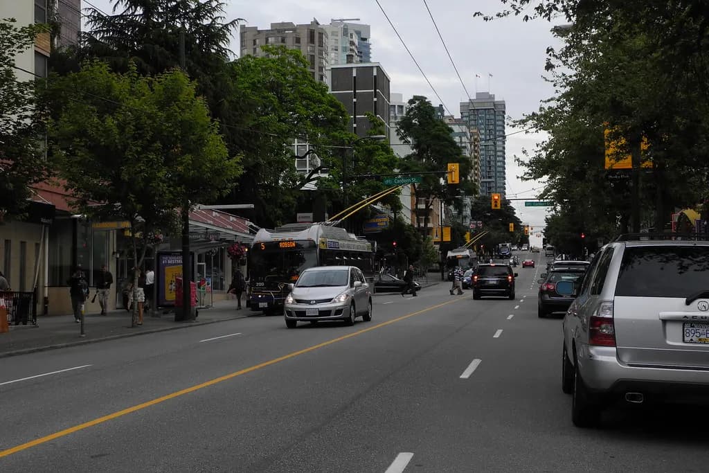 Shoppers walking past storefronts on Robson Street in downtown Vancouver