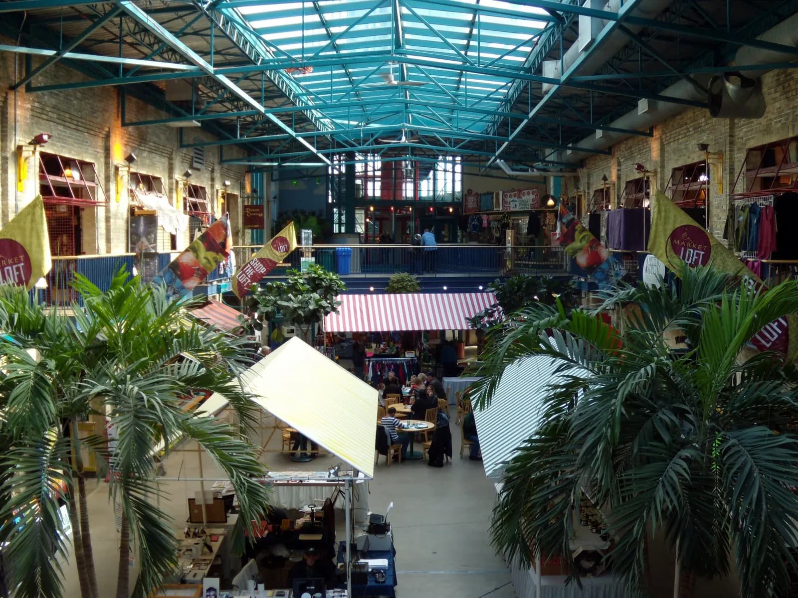 Food stalls and shoppers inside The Forks Market in Winnipeg, Manitoba