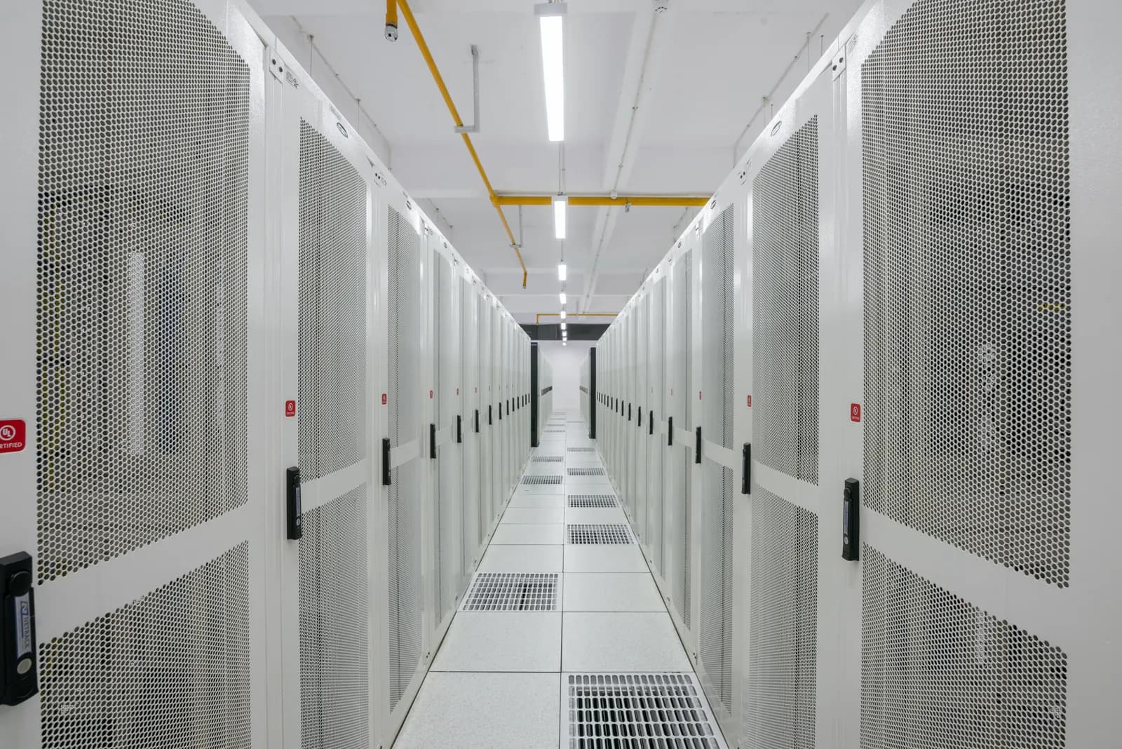 Rows of white server racks along an aisle in a data centre in Amaravati, Andhra Pradesh