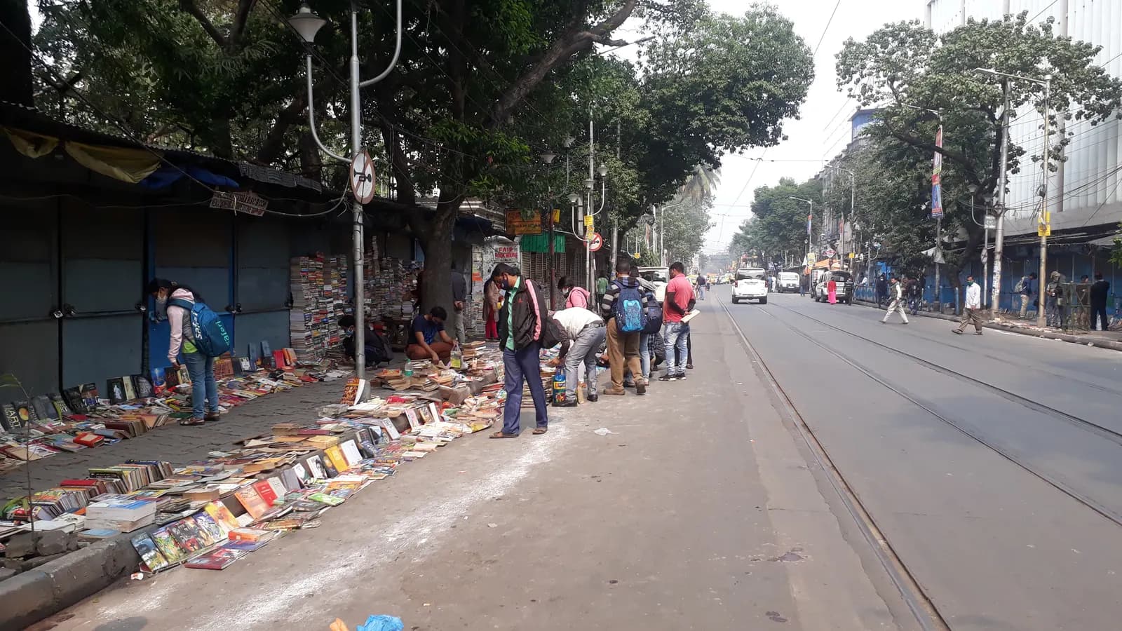 Second-hand and new books laid out on the pavement of College Street book market in Kolkata