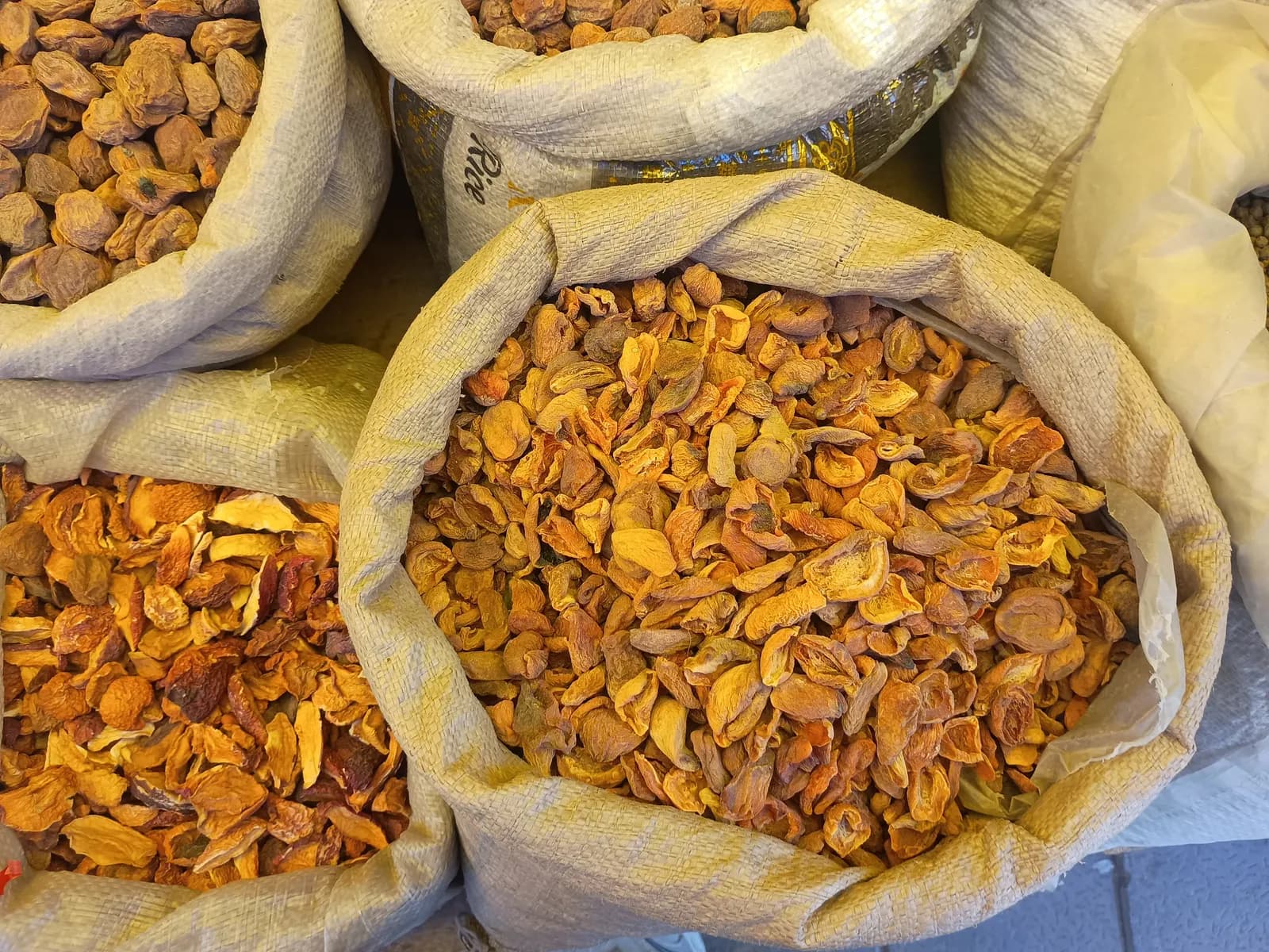 Heaps of dried apricots for sale at a market stall in Leh, Ladakh