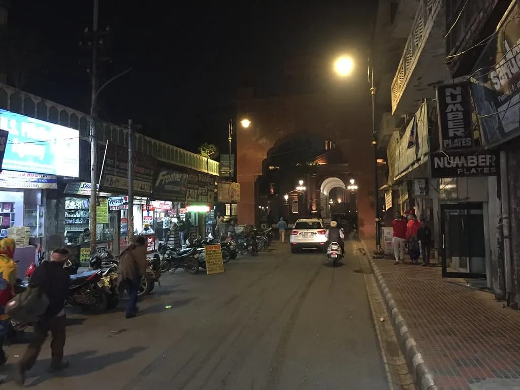 Shops lining Hall Bazaar in Amritsar, Punjab, lit up in the evening