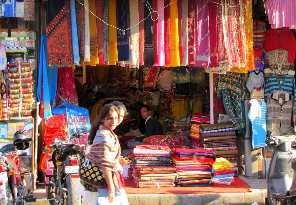 Cloth and garment shops crowded with shoppers in Paltan Bazaar, Dehradun