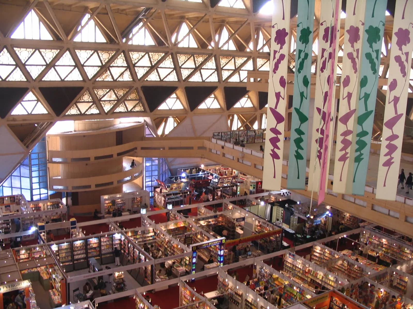 Rows of exhibition stalls inside Hall 6 at Pragati Maidan, New Delhi, seen from the upper gallery