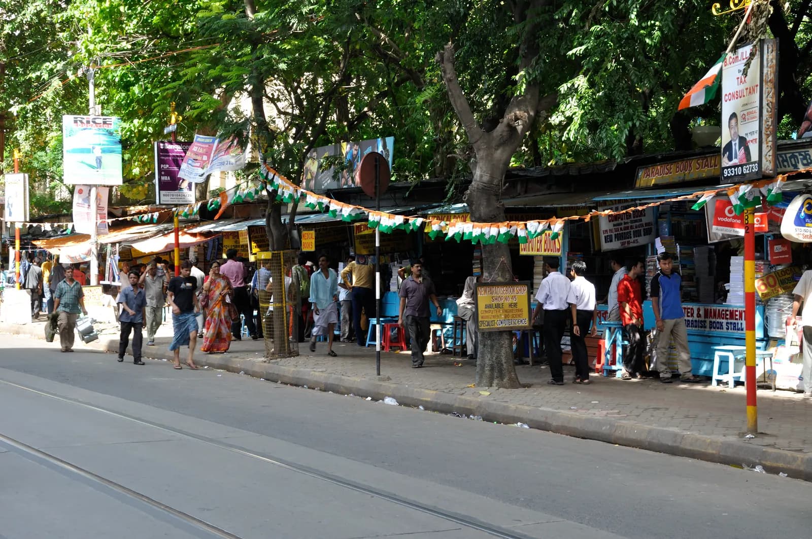 Bookstalls and small shops under the trees along College Street in Kolkata