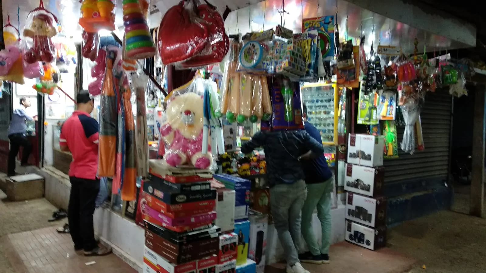 A gift and toy shop at Kochilei Market in Rasulgarh, Bhubaneswar, with stock hanging from the shopfront and boxes stacked outside