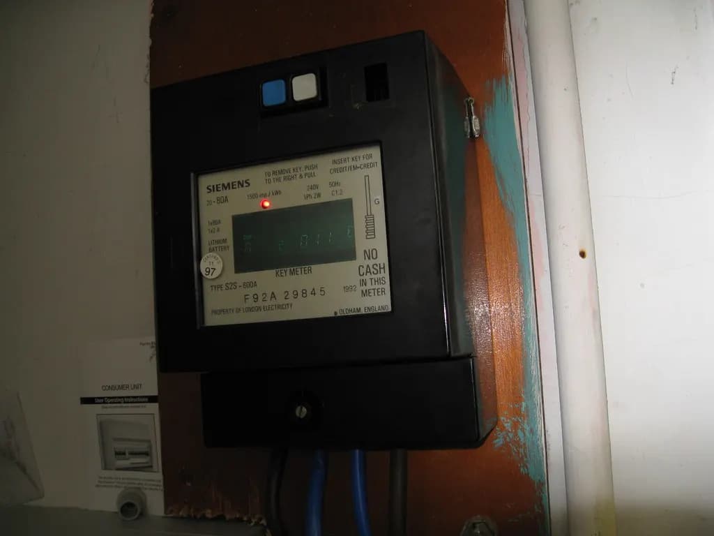 An electronic electricity meter in a UK meter cupboard