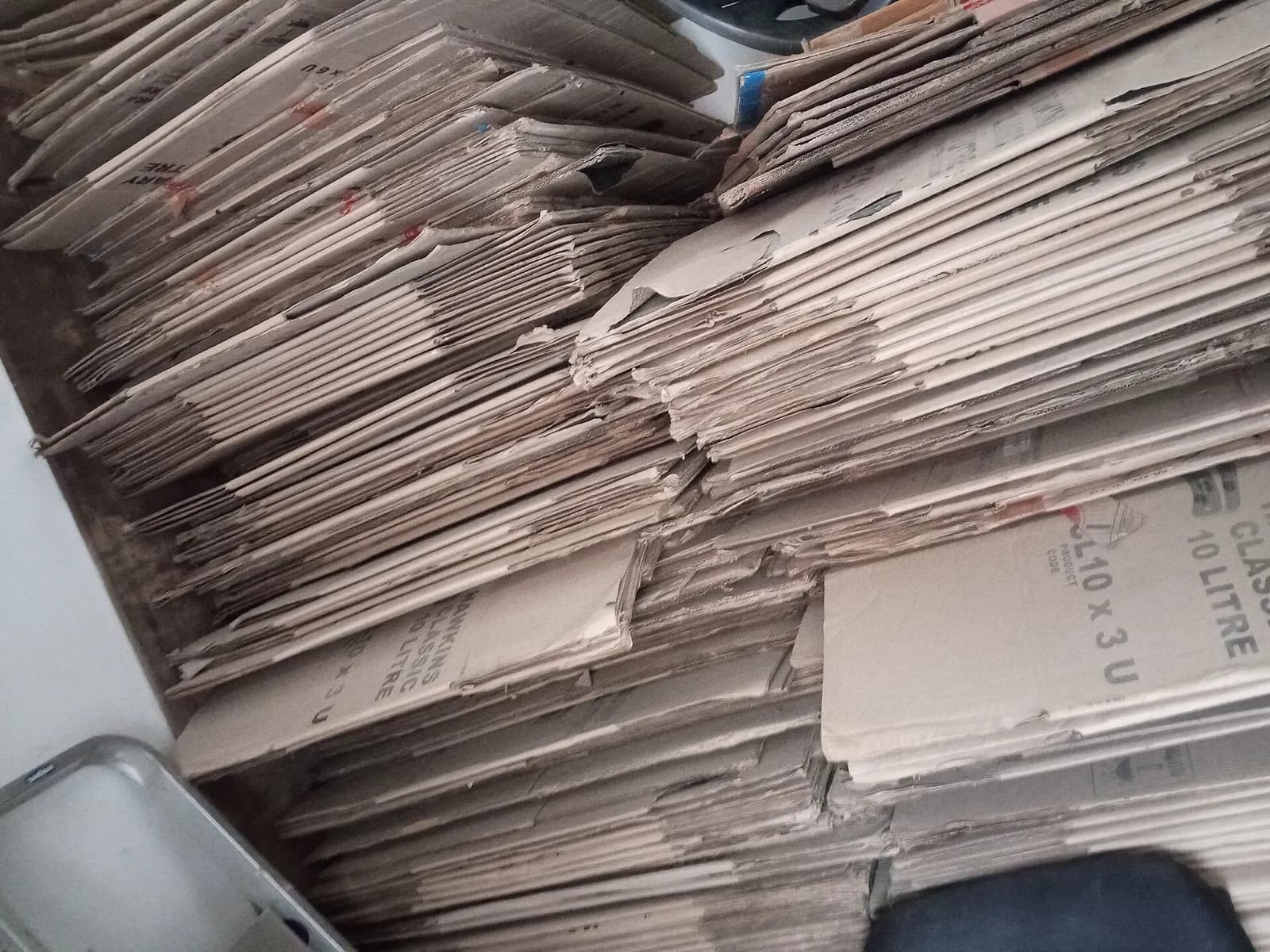 Stacks of flat-packed cardboard boxes ready to be made up for orders