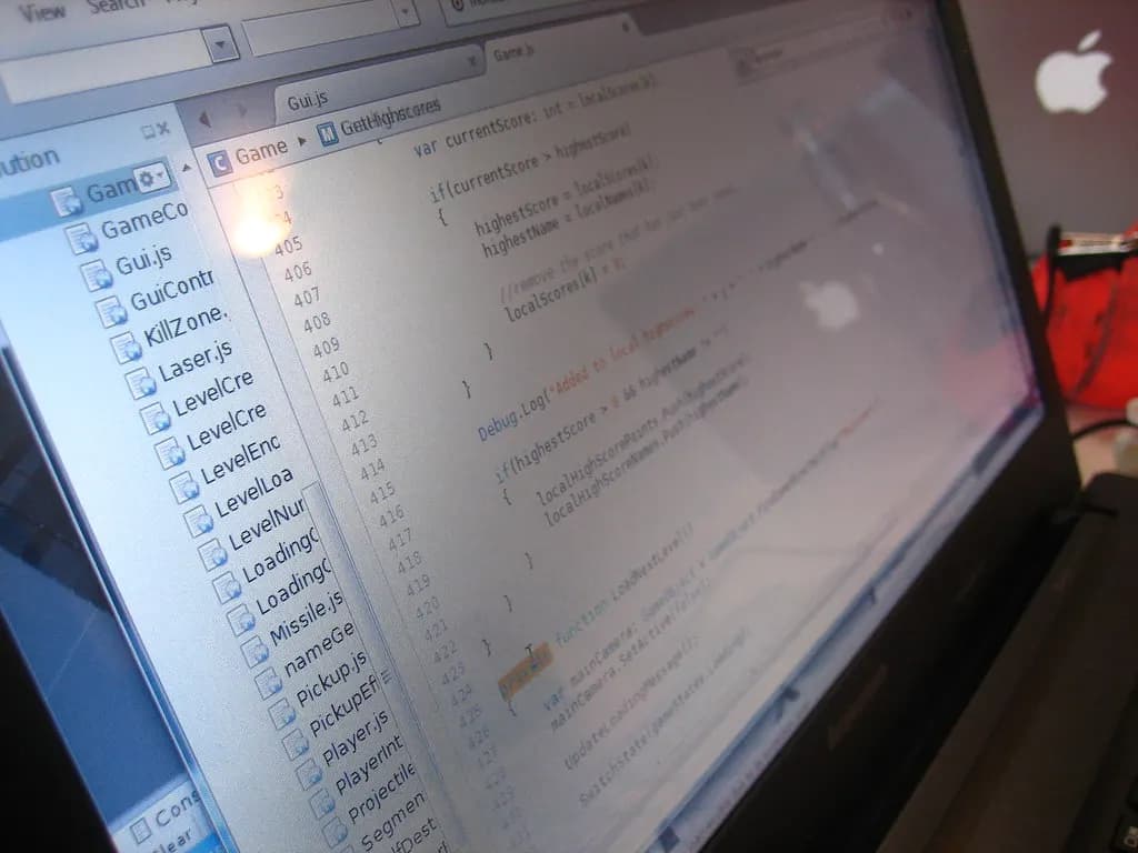 Java source code on a laptop screen in a dim room