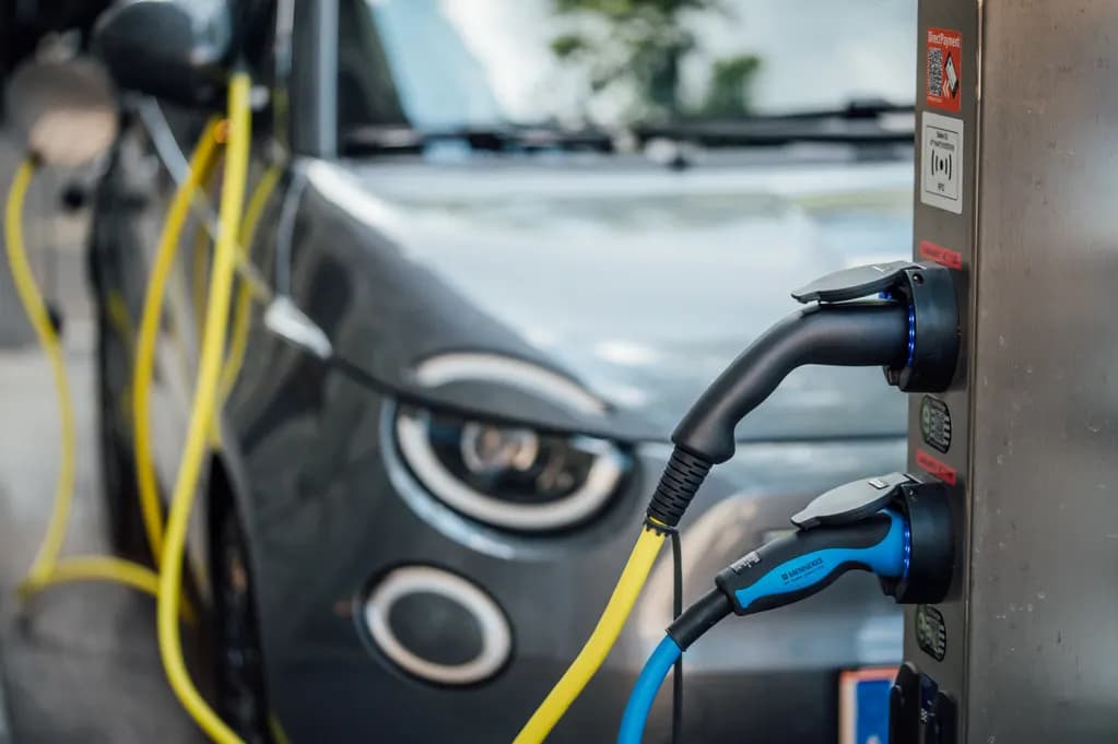 Charging cables plugged into an electric vehicle charging station