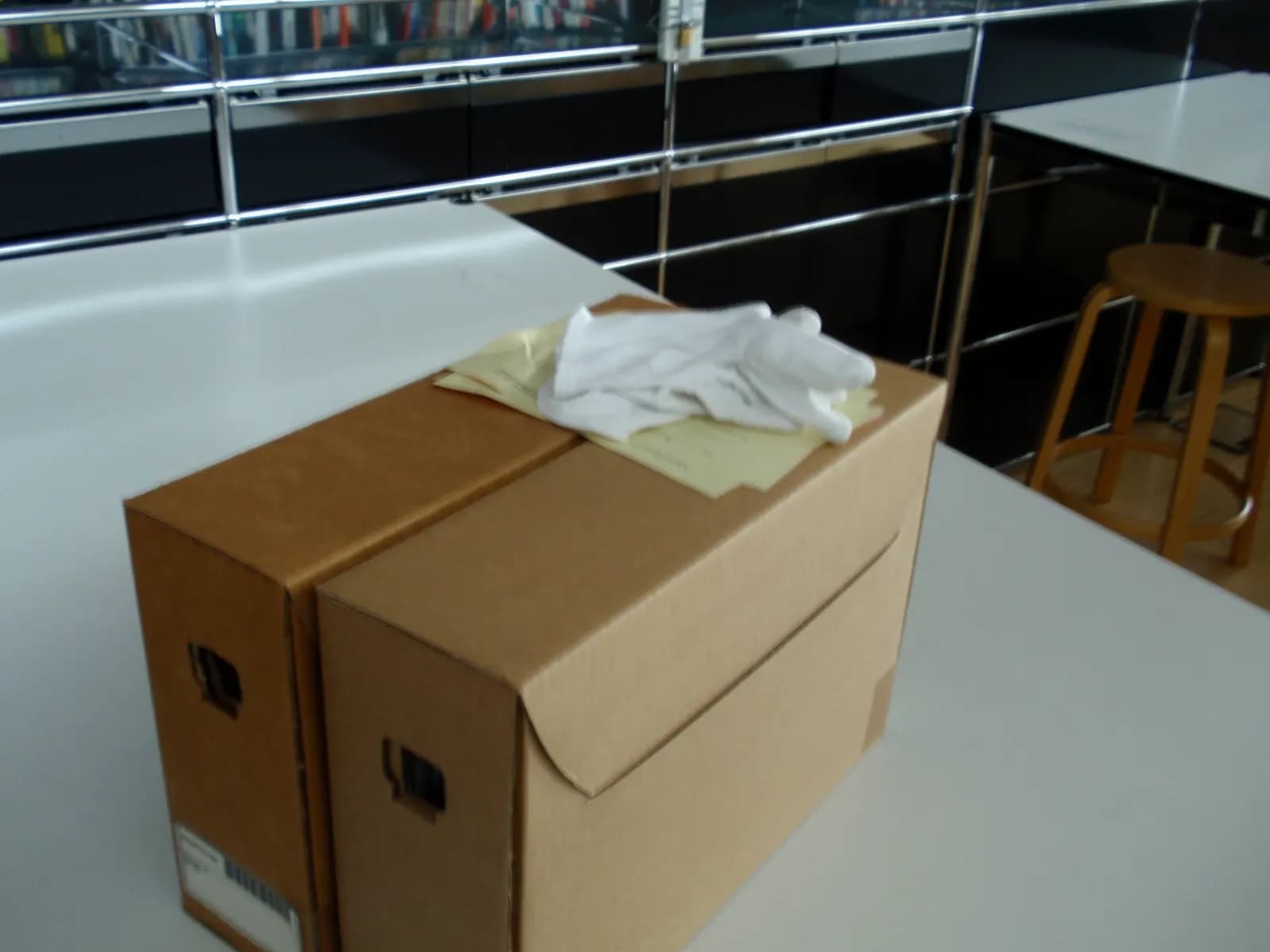 Cardboard archive boxes stacked on a desk ready for storing records