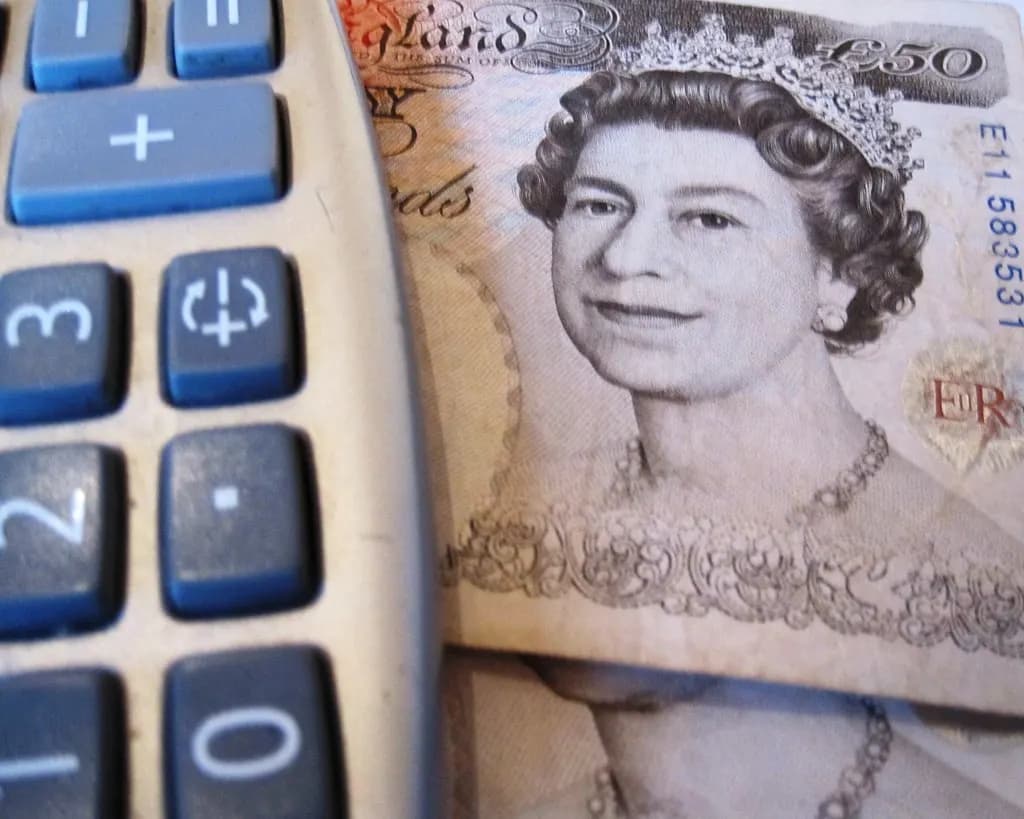A £50 banknote next to a calculator keypad