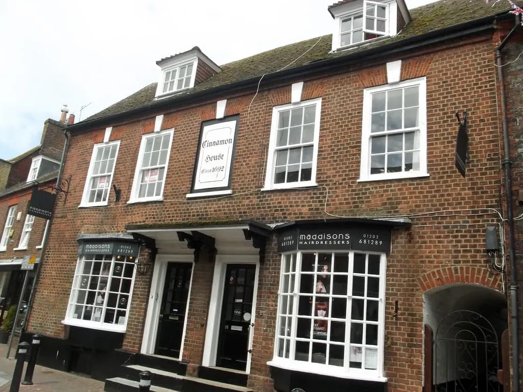 Maddisons Hairdressers shop front on a brick high street building