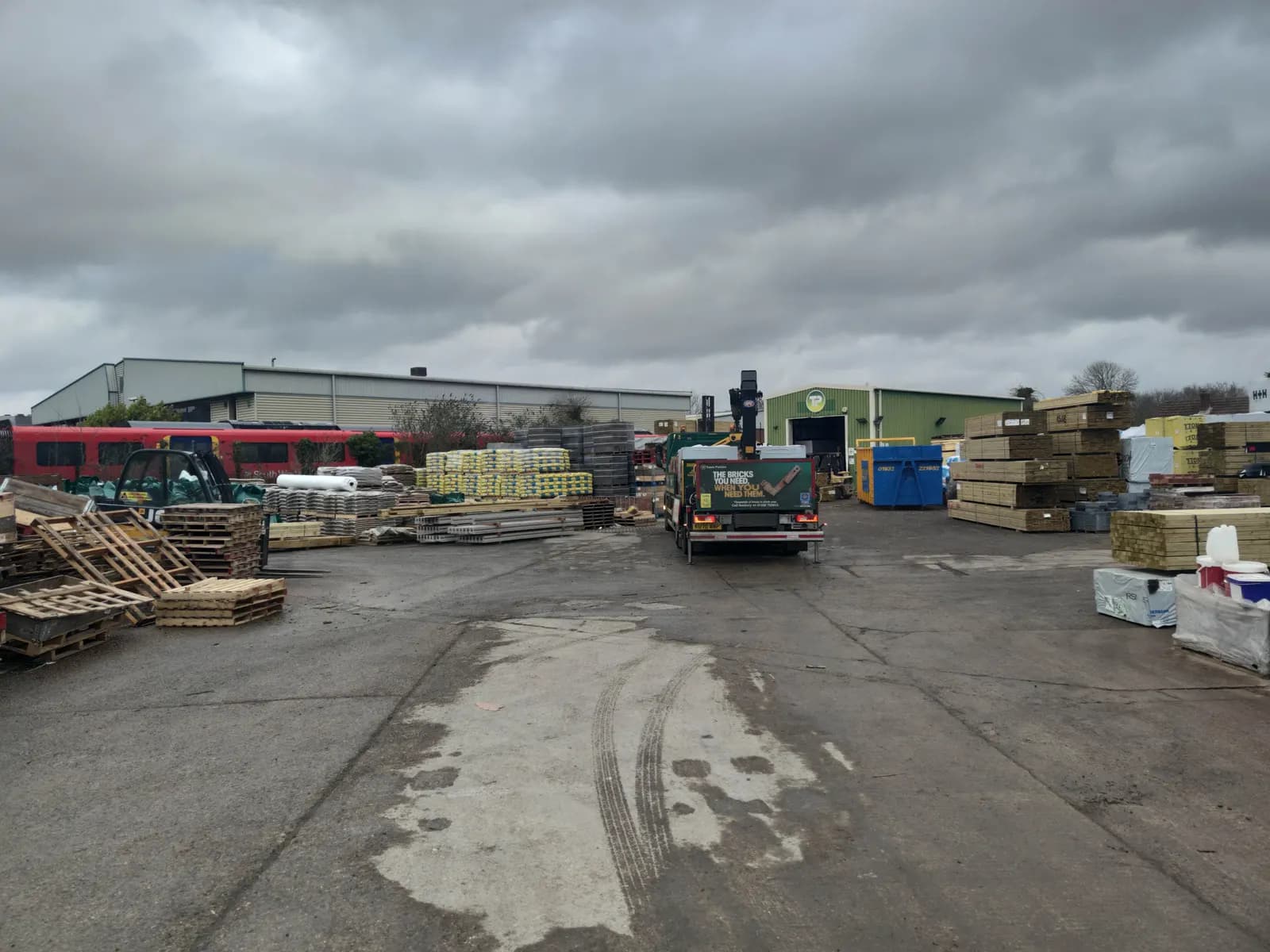 Timber and building materials stacked in a builders' merchant yard