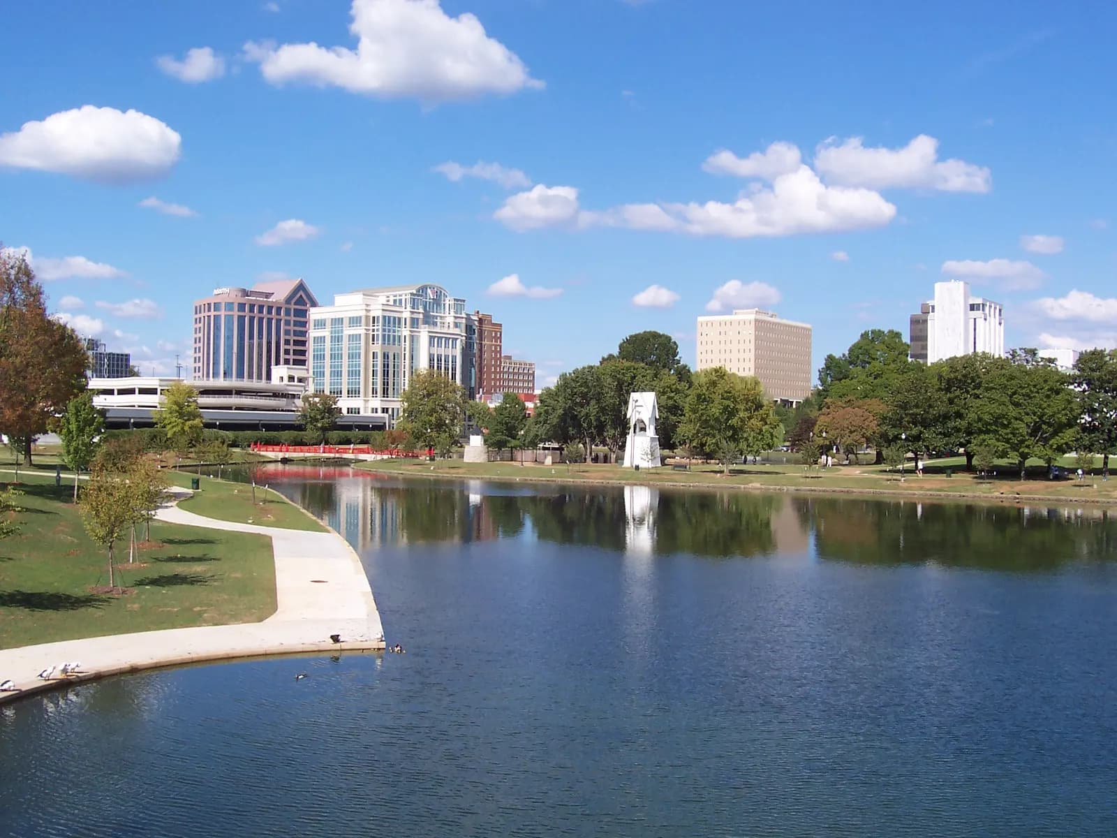 Downtown Huntsville office towers seen across the lake in Big Spring Park on a sunny day