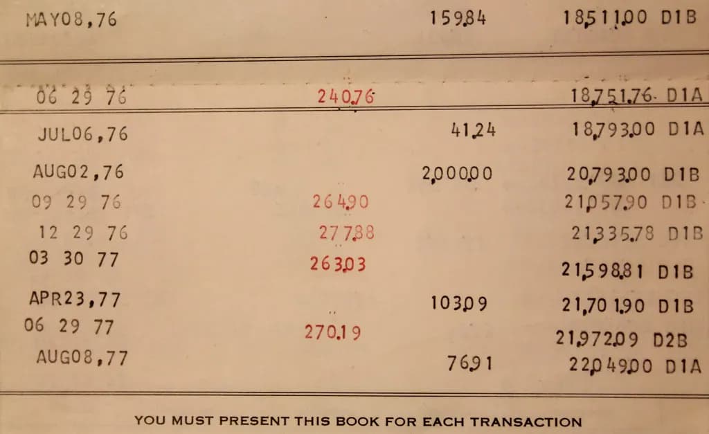 Printed bank passbook page listing dated deposits, interest credits in red and running balances