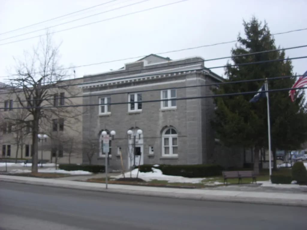 Stone two-storey Schoharie County Clerk's Office building in upstate New York in winter