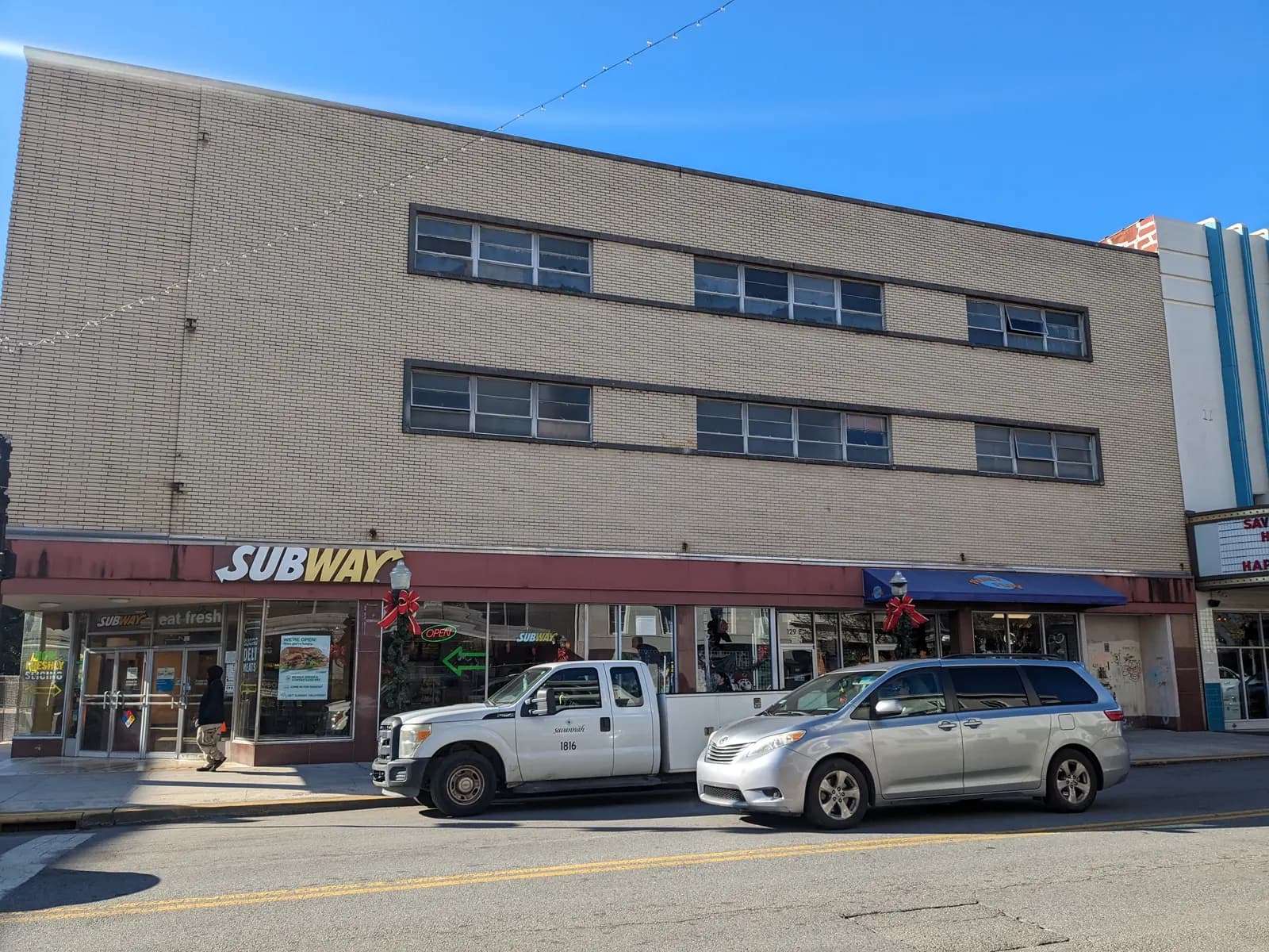 Historic shopfronts at 129–131 East Broughton Street in Savannah, Georgia