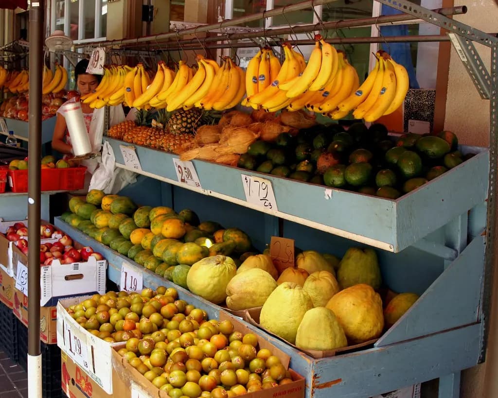 Fruit stall with bananas, papayas, avocados and citrus in Chinatown, Honolulu