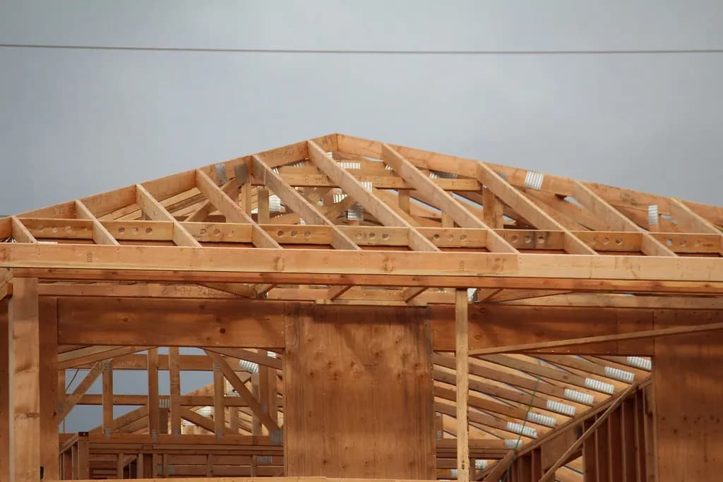 Wood wall framing and roof trusses of a new house under construction