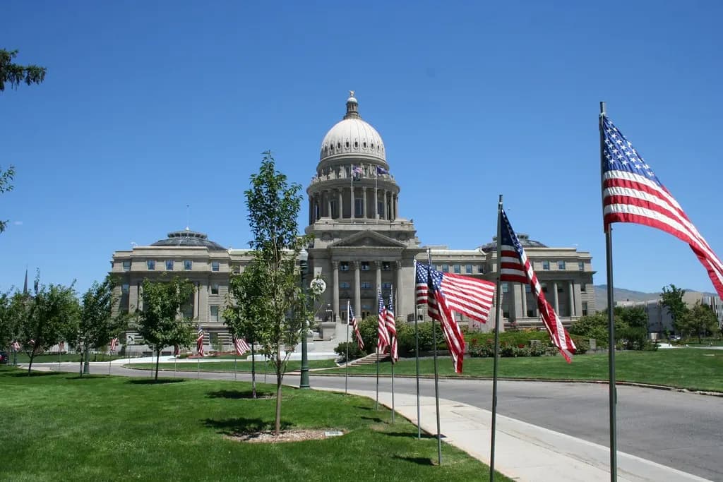 Idaho State Capitol in Boise, a sandstone domed building with flags in front