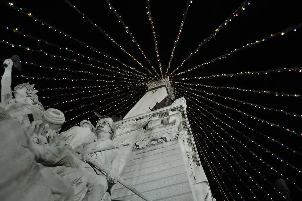 Soldiers' and Sailors' Monument on Monument Circle in downtown Indianapolis surrounded by shops and offices