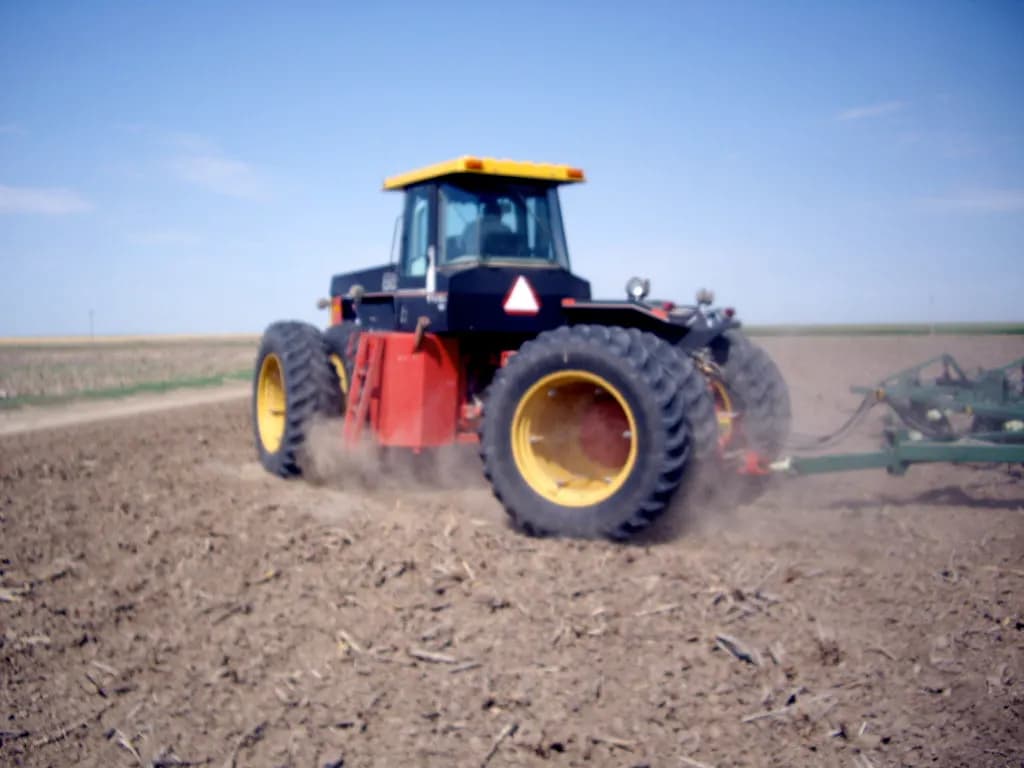 A tractor tilling a summer fallow field in Gove County, western Kansas
