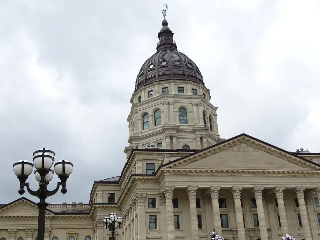 The copper dome and columned portico of the Kansas State Capitol in Topeka