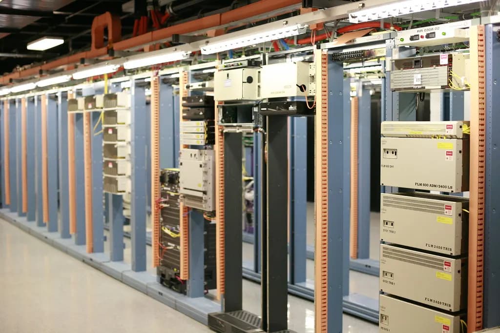 Rows of network and server equipment racks in a data center