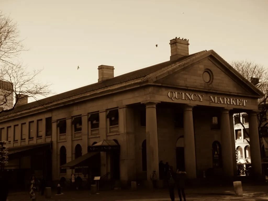 The granite Quincy Market building in Boston, photographed in sepia tones