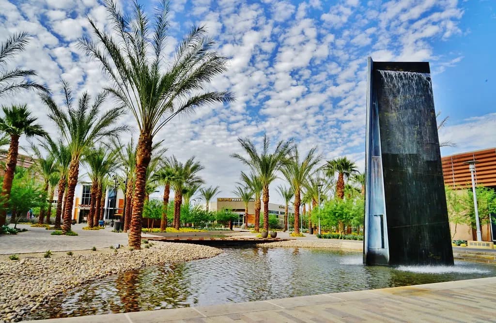 Palm-lined pedestrian plaza with a water feature in the Downtown Summerlin shopping district of the Las Vegas valley